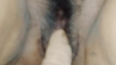 toying herself to cum